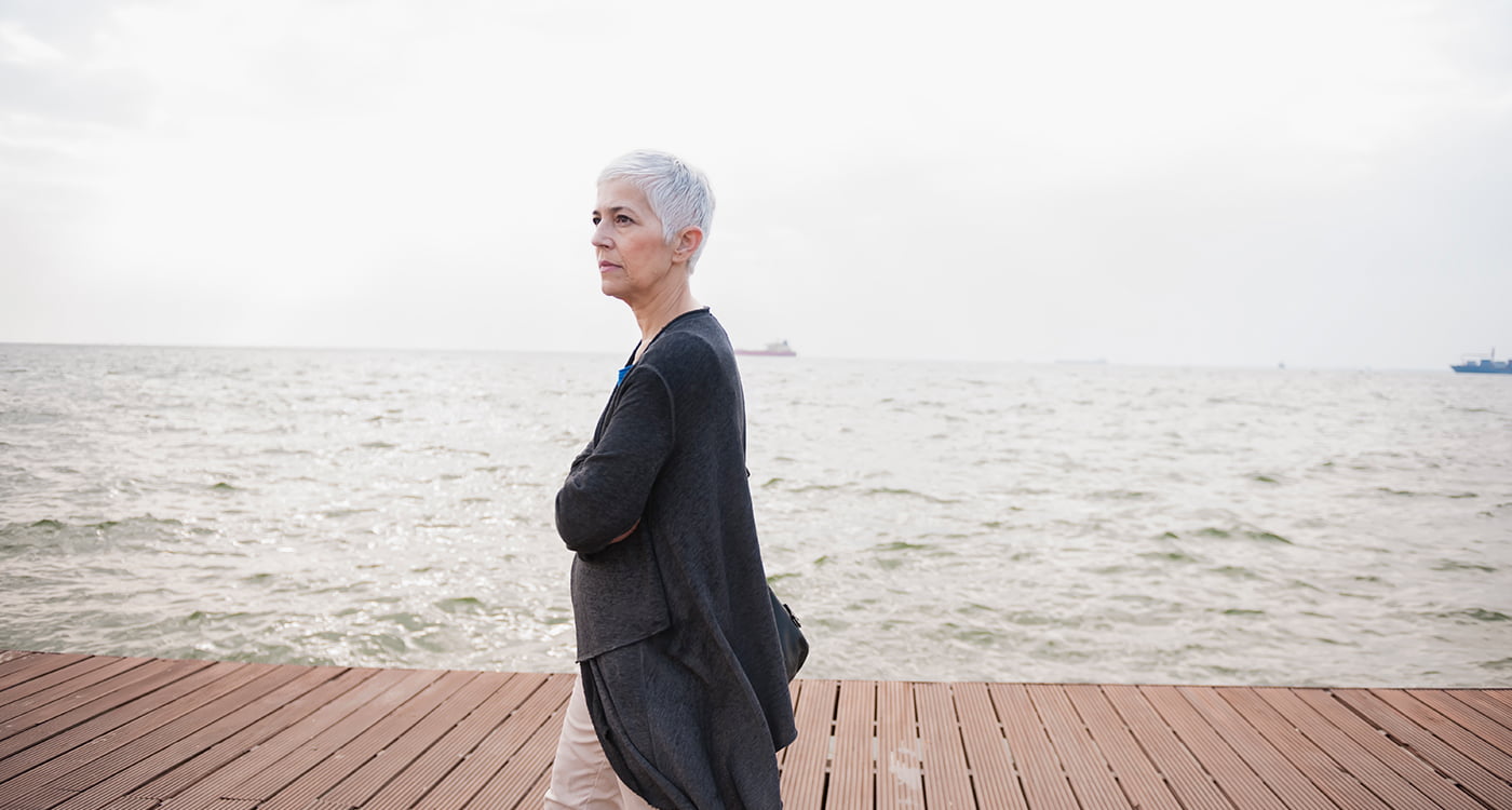 woman walking along the beach